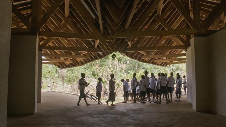 Photo of Ilima Primary School, View from the Hallway to the Exterior Landscacpe and of the school children gathering